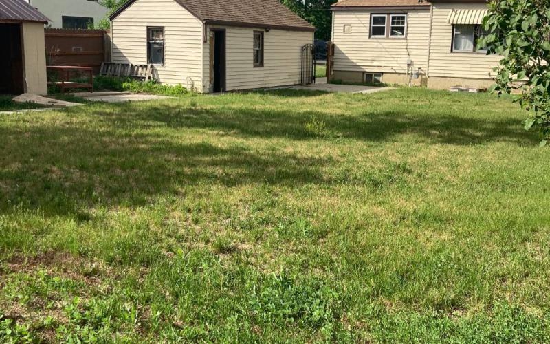 EXTERIOR VIEW BACK. SHED & GARAGE